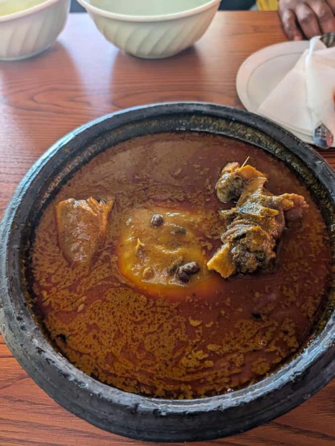 Accra Street Food Tour: Osu Night Market Tour Experience - Chibom brings bread, fish, eggs, and pepper sauce
