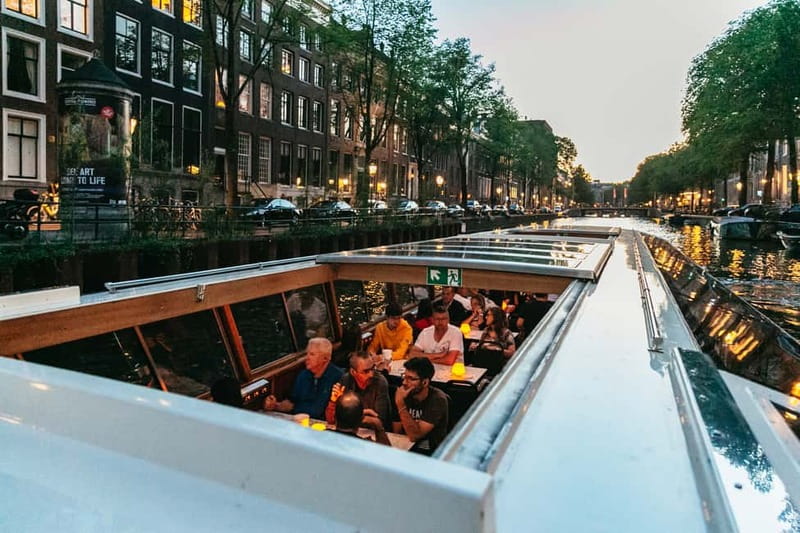 Amsterdam: Evening Cruise with Optional Wine and Snacks - Audio commentary, captains, and the pace on board