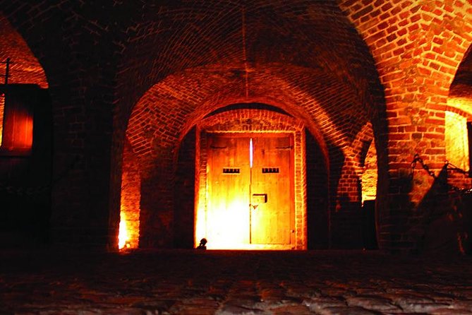 Charleston Ghost & Dungeon Night-Time Walking Tour with Entry to Provost Dungeon - Walking through the French Quarter after dark