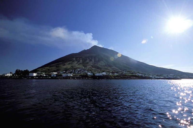 From Tropea: Panarea Island and Stromboli Volcano by Night - Stromboli from 4 p.m.: black sand and blue water