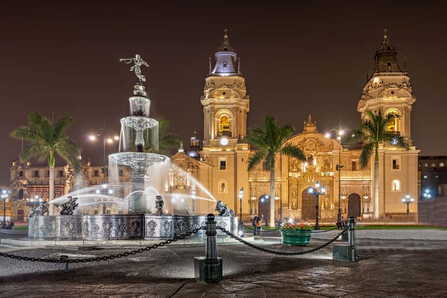 Lima: Water Magic Circuit, Downtown and Catacombs Night Tour - Walking Lima’s Main Square after dark