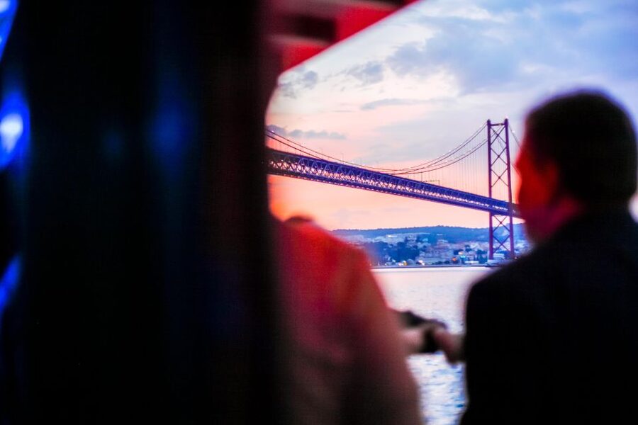 Lisbon: Disco Night Cruise with DJ and Open Bar - The 25 de Abril Bridge from below
