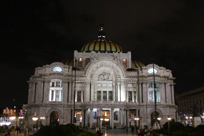 Night Tour of Mexico City Panoramic Ride on a Double-Decker Bus - The Independence Monument lit up at night