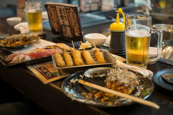 Osaka Backstreet Nightlife & Street Food Walking Tour - Uranamba Torame Yokocho: the first taste of Osaka