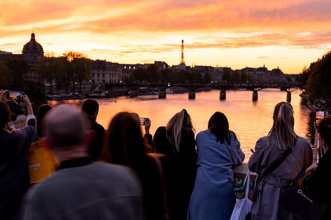Paris Private Night Tour with River Cruise and Champagne Option - Following the Seine toward the Pont des Arts