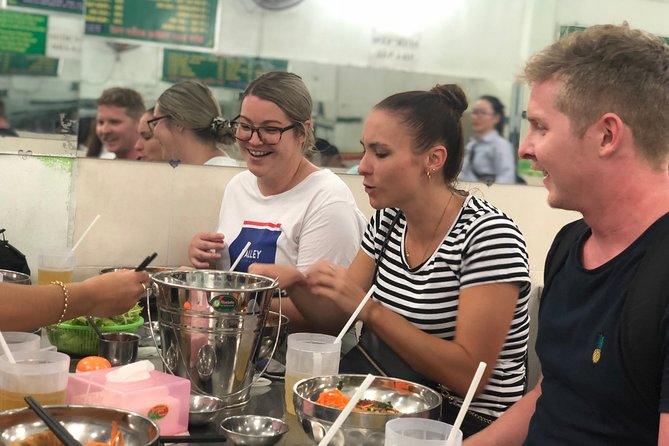 Saigon Evening Food Tour by Scooter - Banh xeo and banh khot with fresh herbs