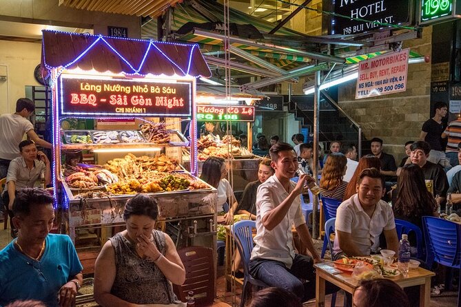 Saigon Night Bites on Foot: Local Vendors, Stories & Sweet Finish - Passing Chua Ba Thien Hau and Ong Lanh Bridge Market