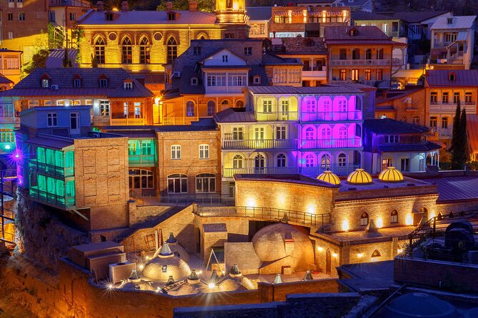 Tbilisi:Evening Walking & Talking Tour with Wine & Boat Ride - Gabriadze’s clock tower and the Bridge of Peace