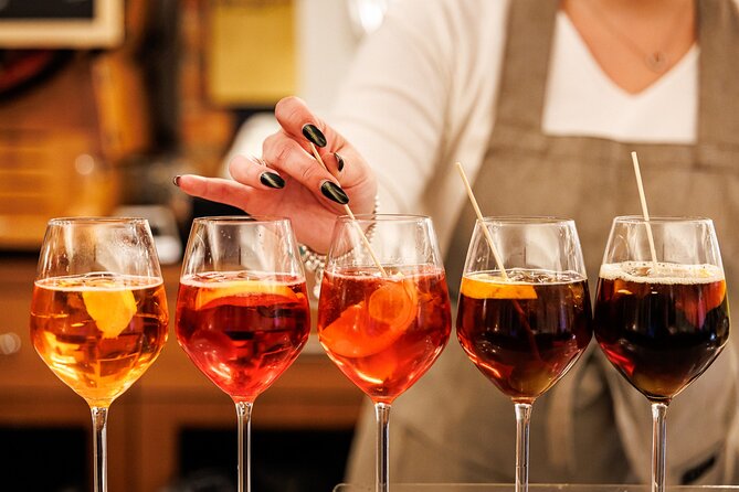 Venice Evening Food Tour: Bites, Drinks & Sit-Down Dinner - Stop one: meat cicchetti and a Venetian Select Spritz