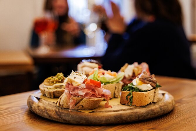 Venice Evening Food Tour: Bites, Drinks & Sit-Down Dinner - Stop two: fish cicchetti and a glass of ombra